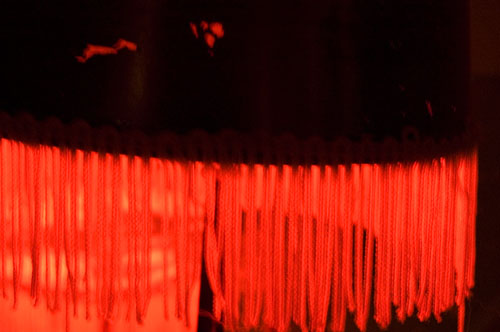 Red Fringe on Glowing Lamp